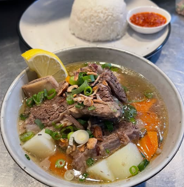 Flat rice noodles served in rich beef broth with beef balls, tender beef ribs, and choy sum
